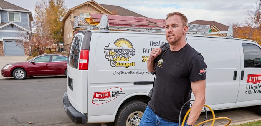 A Weather Changers technician tuning-up an A/C system in Denver, CO.