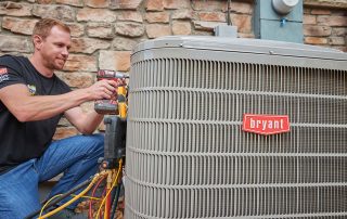 Bryant Heat Pump getting worked on by a Weather Changer technician